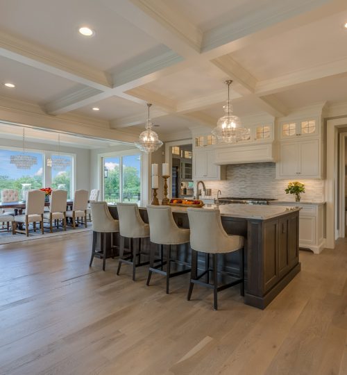 Open floor plan kitchen with coffered ceiling